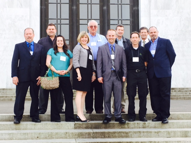 First row includes: Dave Brown, S & S Vending; Kim Hellner, Evergreen Vending; Sandy Larson, NAMA; Jason Brown, S & S Vending (NAVA Treasurer); Glen Boreth, Canteen Vending; Steve Vargas; Atnip Company (NAVA President) Back row includes: Rick Searle, Evergreen Vending; Lou Leberti, Vend West Services; Dan Lind, Cascade Vending; John Powell, Powell & Associates, (NAVA Legislative Consultant)