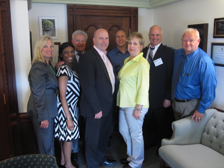 Illinois State Senator Tom Cullerton (center) with IAMC Legislative Day attendees.