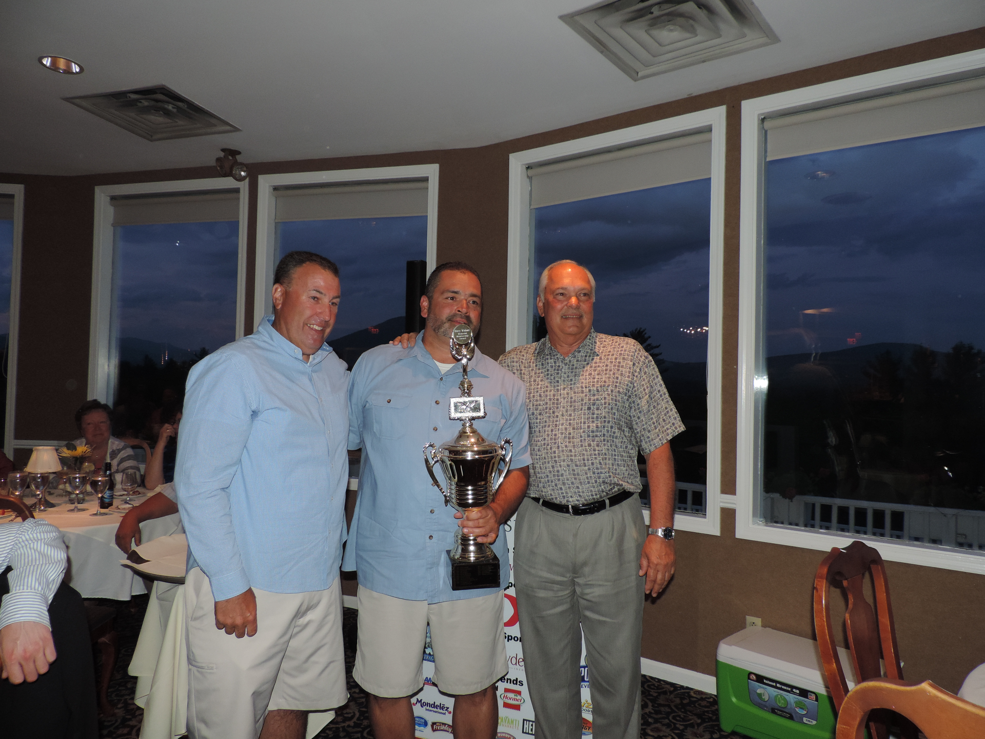 Jeff Terban of Burdette Beckmann, left, and Larry Lathrop of Lathrop Vending, far right, present the 2015 annual Harry Wishart award to Mark Lathrop of Lathrop Vending.