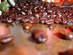 Coffee beans on table 570535db5e298