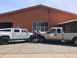 WeServ owner Todd White, left, relies heavily on Jeff Schmaljohann, general manager. The young pup Tito is training to be a guard dog. WeServ owner Todd White, left, relies heavily on Jeff Schmaljohann, general manager. The young pup Tito is training to be a guard dog.