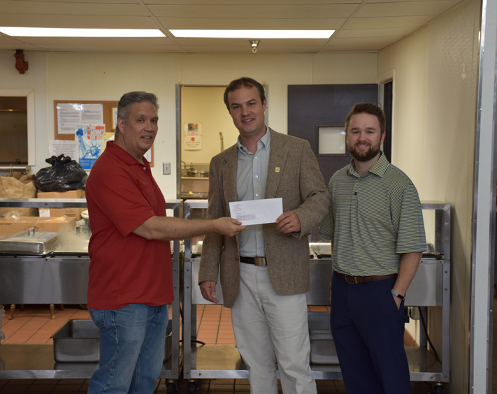 David Amberger, left, Five Star Director of Operations Analysis) with Jens Christensen, Community Kitchen Executive Director, and C. J. Recher, Five Star Director of Marketing.