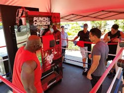 TV Host Mario Lopez was the first to try the punch the McGregor/Mayweather fight promotional vending machine created by American Vending Machines, Inc. and Digital Media Vending. TV Host Mario Lopez was the first to try the punch the McGregor/Mayweather fight promotional vending machine created by American Vending Machines, Inc. and Digital Media Vending.