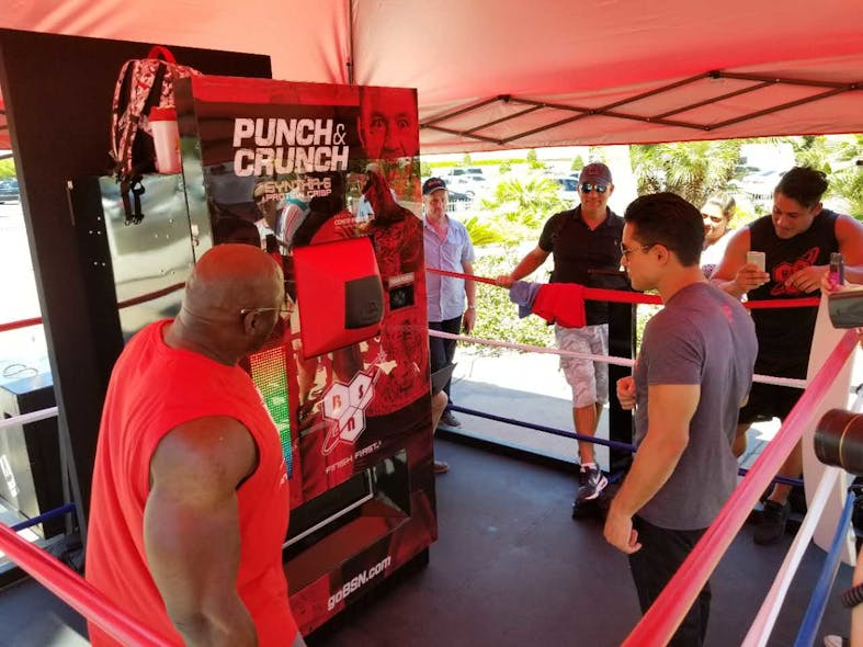 TV Host Mario Lopez was the first to try the punch the McGregor/Mayweather fight promotional vending machine created by American Vending Machines, Inc. and Digital Media Vending.