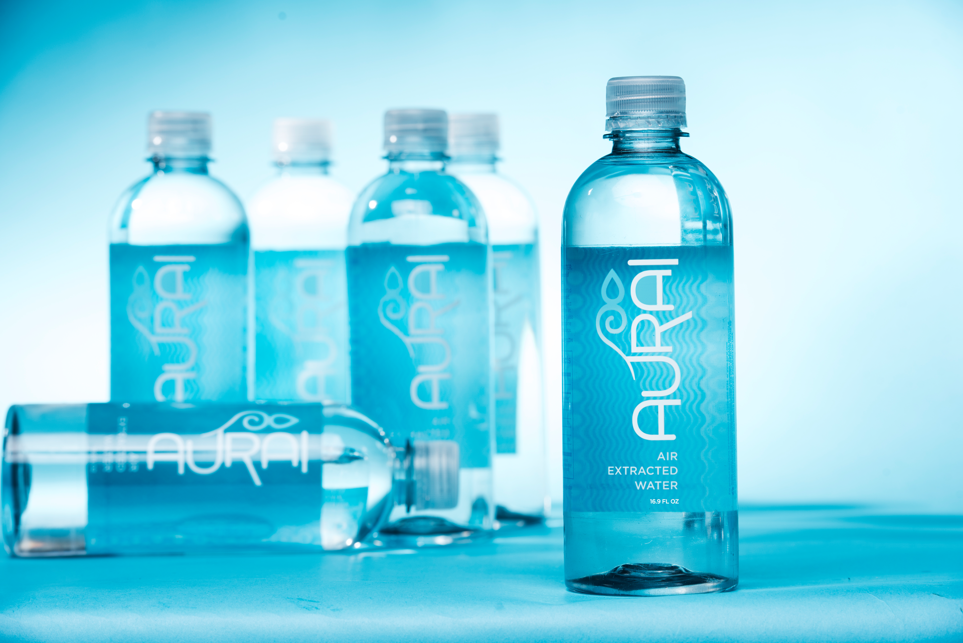 AURAI Multiple Bottles against Blue 5a147948981af