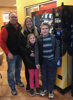 Heath and his family in front of one of their Naturals2Go vending machines. Heath and his family in front of one of their Naturals2Go vending machines.