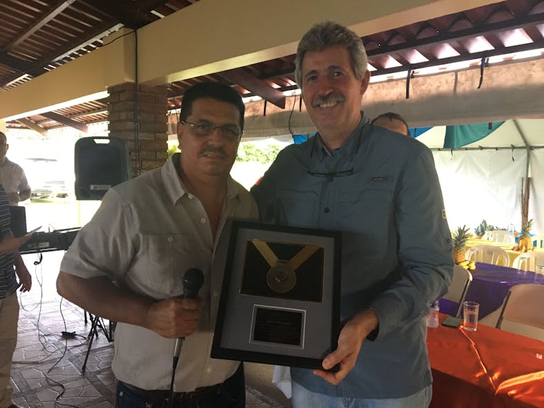 Raul Martinez (right), General Manager of Dole Standard Fruit de Costa Rica, receives a plaque from Jose Miguel Ramirez, General Manager of Recyplast, in recognition of the contribution of Dole&apos;s banana plantations in the correct handling, storage, and provision of field plastic waste.
