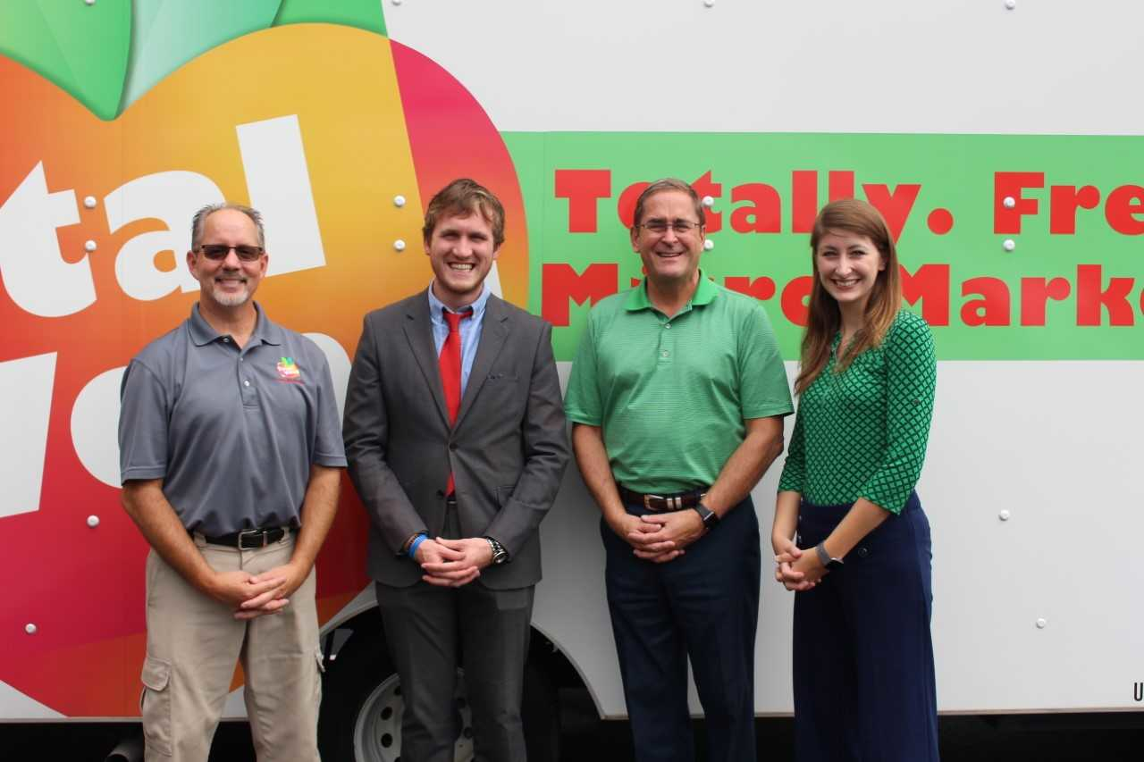 (From Left) David Ratterman; Andrew Condia, field representative for Senator Mitch McConnell; Ron White and Alicia White
