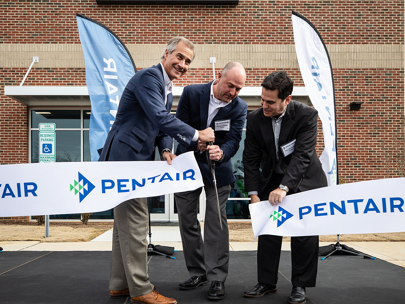 Pentair President and CEO, John Stauch, Steve Risner, Sr. Director of Technology, and Phil Rolchigo, Chief Technology Officer, celebrated the opening of Pentair's new innovation center in Apex, N.C.