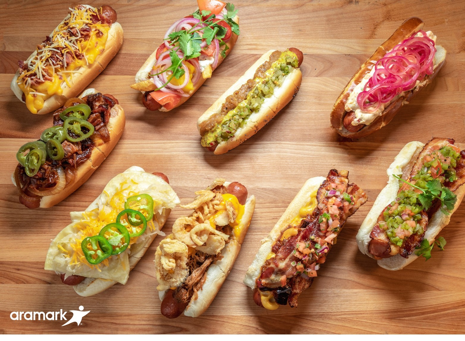 Aramark, the award winning food and hospitality partner of nine Major League Baseball teams, is celebrating National Hot Dog Day, July 17, 2019, with a decadent selection of a dozen loaded hot dogs, sausages and vegan dogs at the ballparks it serves.