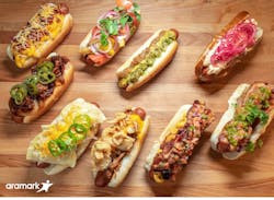 Aramark, the award winning food and hospitality partner of nine Major League Baseball teams, is celebrating National Hot Dog Day, July 17, 2019, with a decadent selection of a dozen loaded hot dogs, sausages and vegan dogs at the ballparks it serves. Aramark, the award winning food and hospitality partner of nine Major League Baseball teams, is celebrating National Hot Dog Day, July 17, 2019, with a decadent selection of a dozen loaded hot dogs, sausages and vegan dogs at the ballparks it serves.