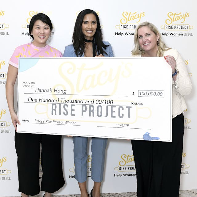 NEW YORK, NEW YORK - NOVEMBER 04: Ahead of Women&apos;s Entrepreneurship Day, entrepreneur Padma Lakshmi (C) and Jessica Spaulding (R) of Stacy&apos;s Pita Chips announce entrepreneur Hannah Hong, founder of Hakuna Brands, as the $100,000 grand prize winner of the inaugural &apos;Stacy&apos;s Rise Project&apos; at a female empowerment luncheon on November 04, 2019, in New York City.