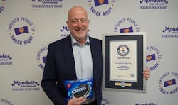 Dirk Van de Put accepts Guinness World Records title certificate for most people dunking cookies across multiple venues. Dirk Van de Put accepts Guinness World Records title certificate for most people dunking cookies across multiple venues.