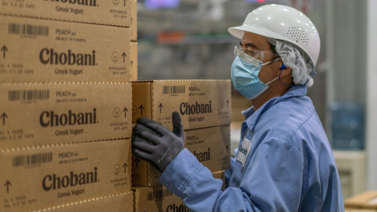 Chobani is increasing the starting wage for their hourly employees to $15 an hour, more than double the federal minimum wage. A Chobani employee, seen here, at the company&apos;s manufacturing plant in South Edmeston, N.Y.