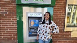 Blue Ridge Bank employee Daesha Graves shows off Mineral, VA, branch&rsquo;s drive-through ATM with bitcoin capability.