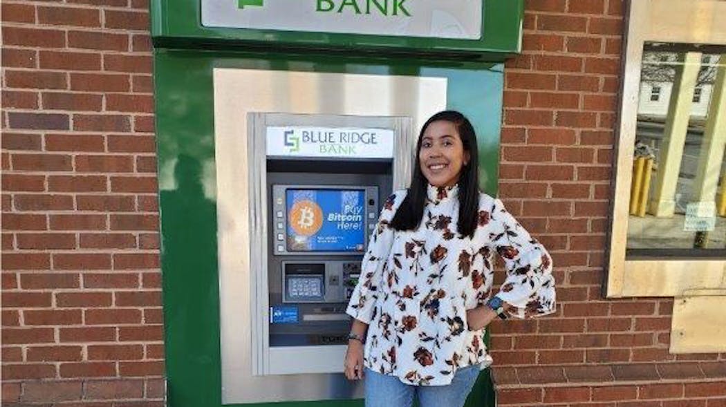 Blue Ridge Bank employee Daesha Graves shows off Mineral, VA, branch&rsquo;s drive-through ATM with bitcoin capability.