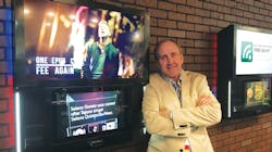 Mike Maas is pictured with AMI Entertainment's NGX Ultra wall-mount jukebox. Mike Maas is pictured with AMI Entertainment's NGX Ultra wall-mount jukebox.