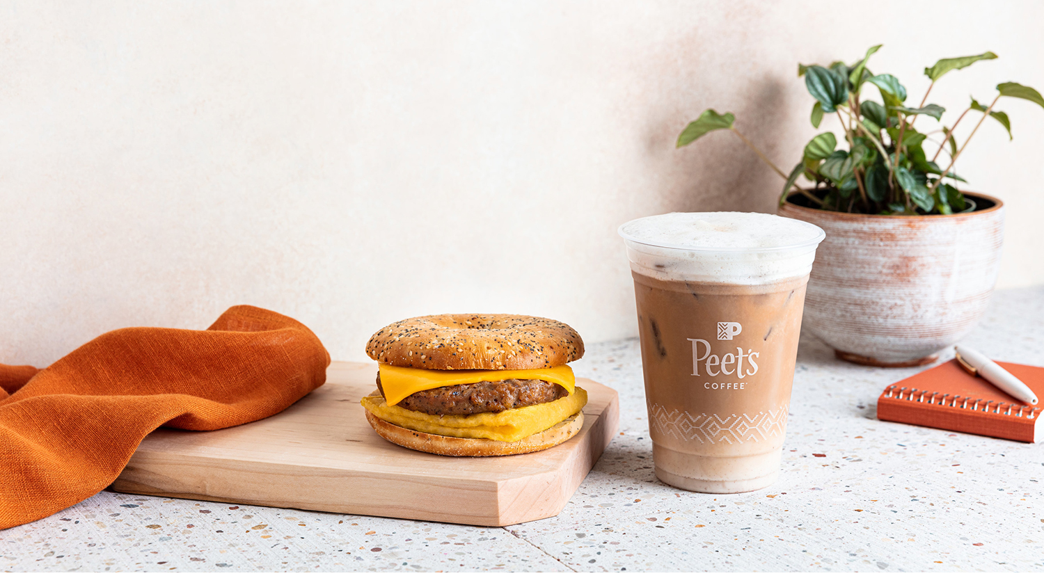 Peet's Everything plant-based breakfast sandwich is juxtaposed with Peet's Horchata cold brew oat latte.