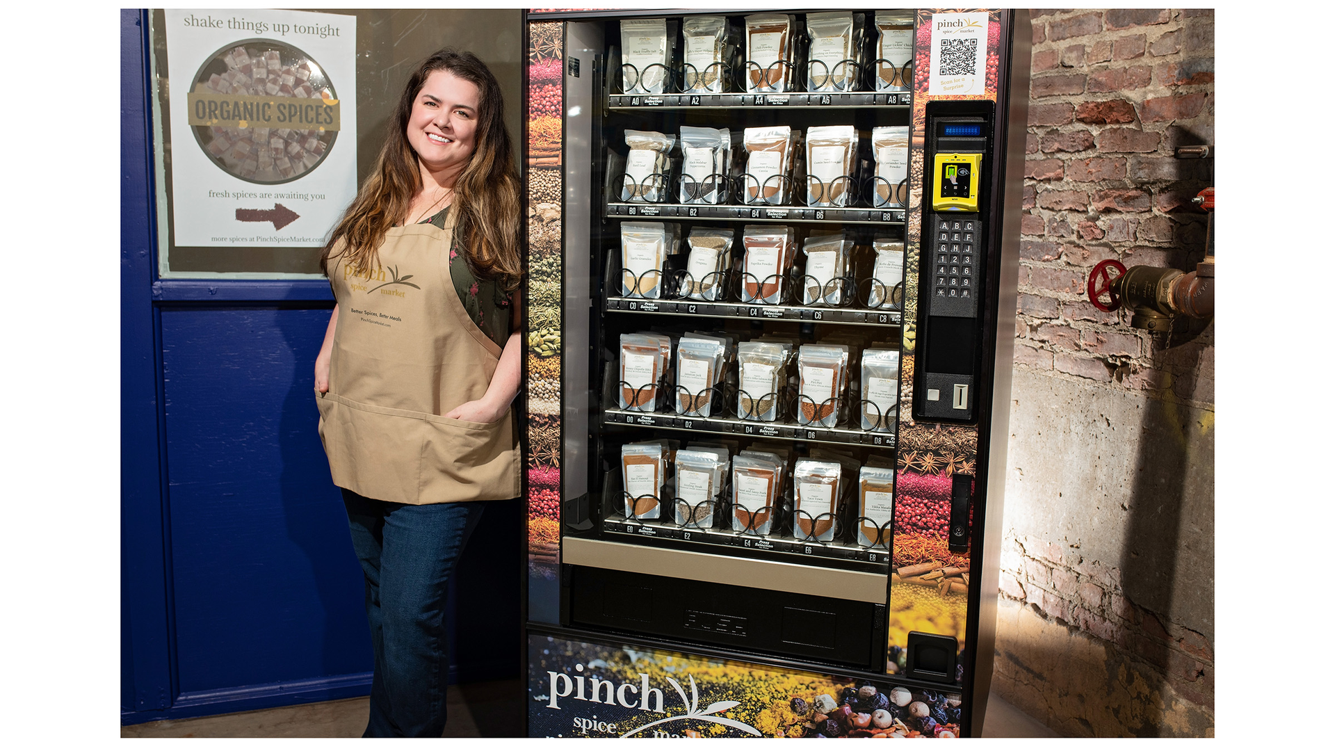 Pinch Spice Market's Meaghan Thomas shows off her spice vending machine.