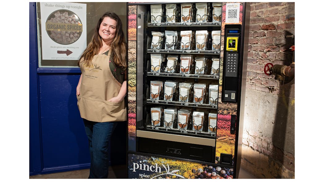 Pinch Spice Market&apos;s Meaghan Thomas shows off her spice vending machine.