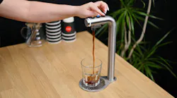 POUR'D dispensing a small shot.