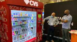 Swyft chief executive Gower Smith demonstrates vending platform with CVS branding.