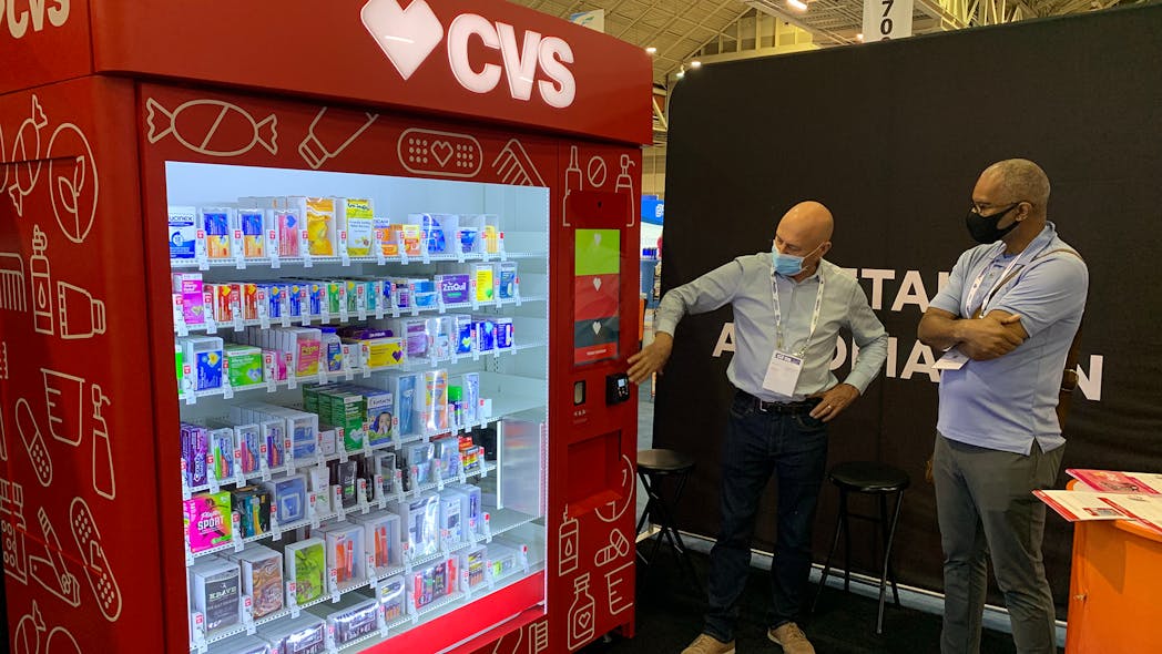 Swyft chief executive Gower Smith demonstrates vending platform with CVS branding.