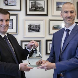 Waterlogic official presents Oceansaver award to Olly Craughan, DPD&apos;s head of corporate social responsibility.