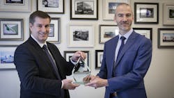 Waterlogic official presents Oceansaver award to Olly Craughan, DPD's head of corporate social responsibility. Waterlogic official presents Oceansaver award to Olly Craughan, DPD's head of corporate social responsibility.
