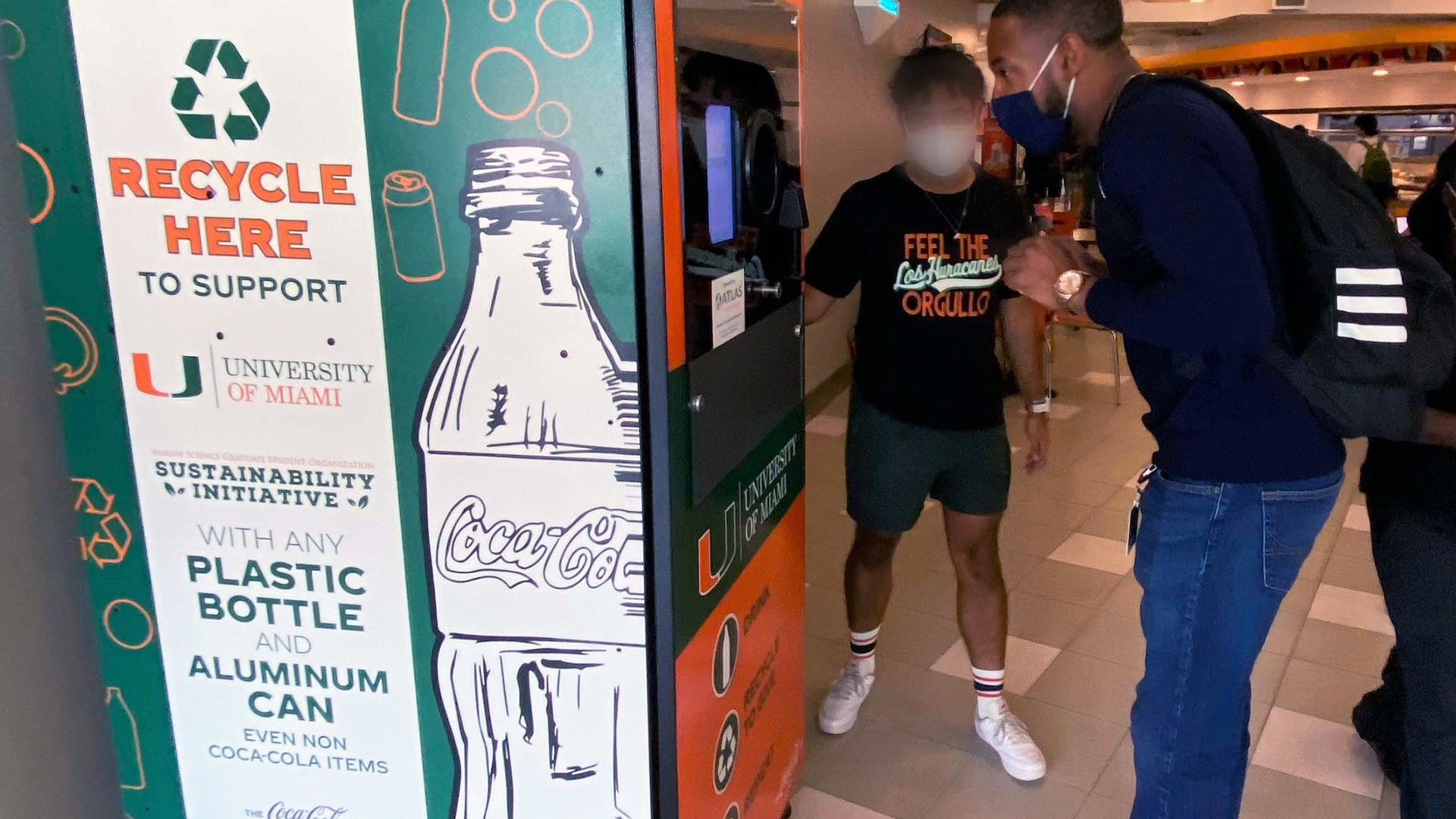 New reverse vending machine is pictured with recyclers in Hurricanes Food Court at University of Miami on America Recycles Day, Nov. 15.