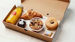 GEC&apos;s Good Start Breakfast Box includes dry cure ham, cheese, tomato, mini bagel and croissant, granola and yogurt pot, strawberry conserve and freshly squeezed orange juice. Sells for &pound;12.30 (about $16.80).