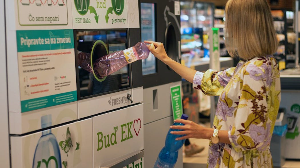 Tomra Person Recycling At Reverse Vending Machine
