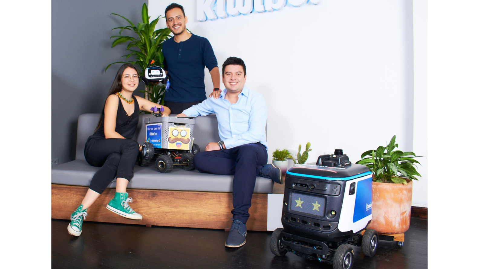 Kiwibot's executive team is pictured at company's new Miami HQ. They are, from left, manufacturing head Natalia Pinilla, chief executive Felipe Ch&aacute;vez and president Sergio Pach&oacute;n.