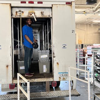 Marcus loads his truck for the day&rsquo;s deliveries.