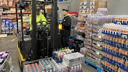 Mitch and Aaron Berger discuss a beverage order. Mitch and Aaron Berger discuss a beverage order.