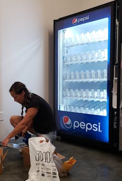 Kayla installs credit card reader. Kayla installs credit card reader.