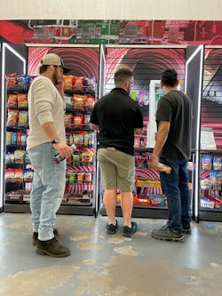DAC team shows employees how to use the kiosk at E-ONE micro market. DAC team shows employees how to use the kiosk at E-ONE micro market.
