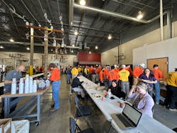 Crowd lines up for lunch at Executive Refreshments customer appreciation event, featuring catered food, ice cream trucks and barista bars.