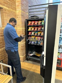 Delivery driver Tyrone restocks a vending machine on one of Executive Refreshments’ seven routes. Delivery driver Tyrone restocks a vending machine on one of Executive Refreshments’ seven routes.