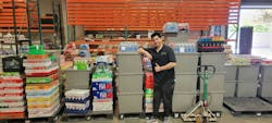 Warehouse lead, Jake, picks products for the day.
