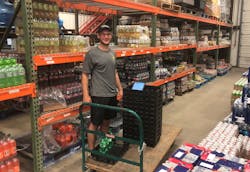 Andrew Moran picking product. Andrew Moran picking product.