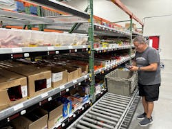 Quality Vending's Al Christofano pulling snacks in the warehouse. Quality Vending's Al Christofano pulling snacks in the warehouse.