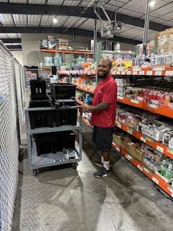 Quality Vending's Khary Mosby pulling soda. Quality Vending's Khary Mosby pulling soda.
