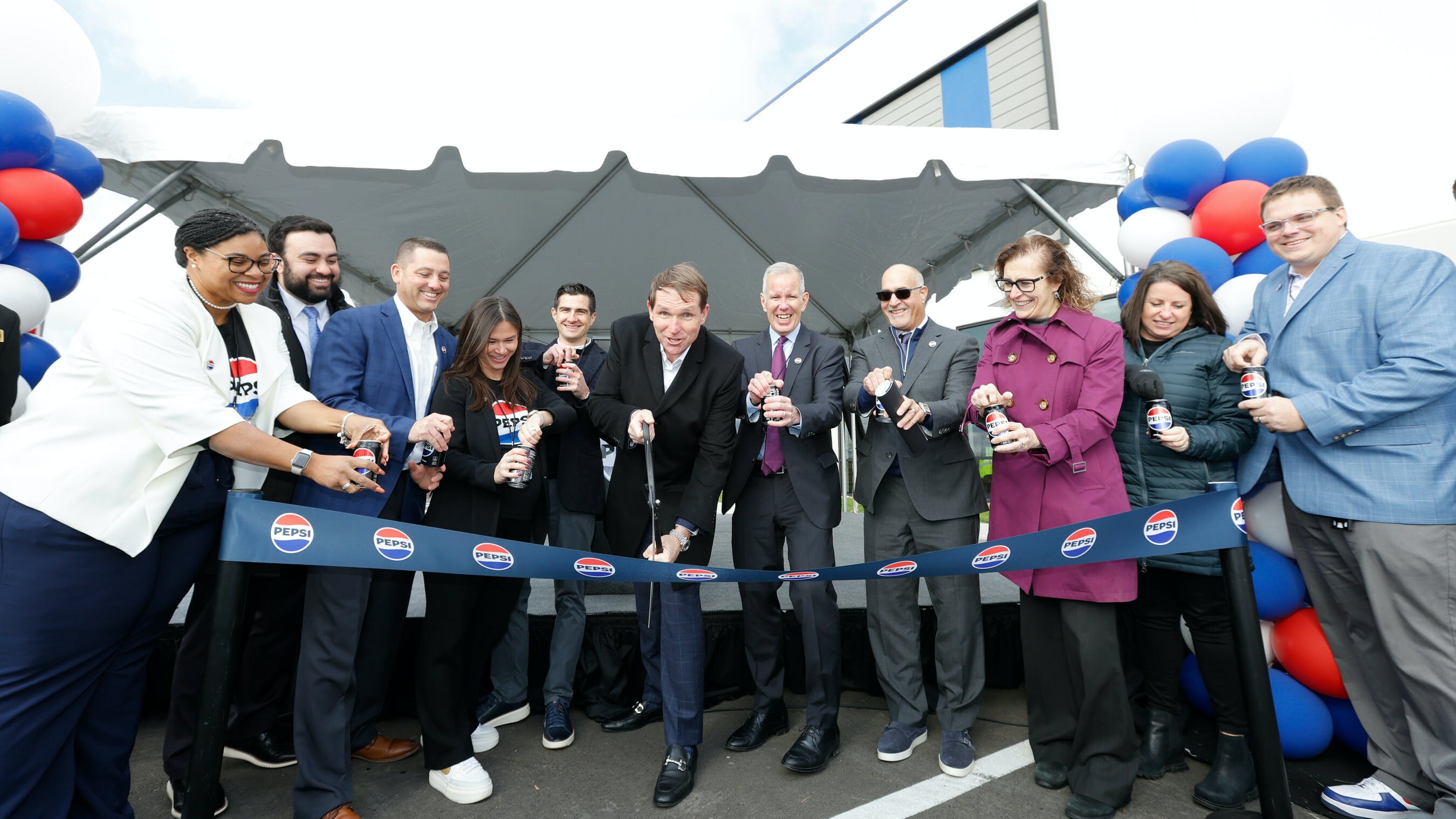 PepsiCo Beverages North America CEO Kirk Tanner, North Division President Richard Glover, GM SVP John Reale and guests participate in ceremonial ribbon cutting for PBNA&rsquo;s new distribution and satellite warehouse on Wednesday, November 1, 2023, in Coraopolis, Pennsylvania.