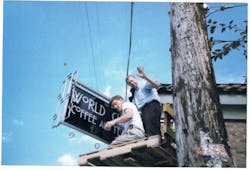 Don Welch and Steve Williams erecting the sign at their first coffee shop in 1999. Don Welch and Steve Williams erecting the sign at their first coffee shop in 1999.