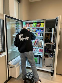 Mike Jamison placing a new vending machine in its first location. Mike Jamison placing a new vending machine in its first location.