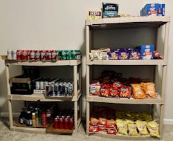 Stocked shelves with a variety of beverages and snacks ready for vending. Stocked shelves with a variety of beverages and snacks ready for vending.