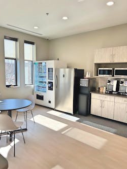 A modern breakroom featuring a NewAge Vending machine alongside A modern breakroom featuring a NewAge Vending machine alongside