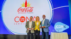 Terrence Gee, (right) senior vice president, Technology and Enterprise Transformation for Coca-Cola Beverages Florida, LLC, accepts the Blue Yonder 2024 ICONic Award for Supply Chain Resiliency. He is joined by (left-right) Baron Jordan, chief product officer - supply chain, CONA Services LLC and Susan Beal, chief customer officer, Blue Yonder. (Photo: Business Wire)
