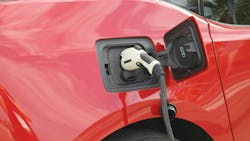 Red car electric vehicle charging Red car electric vehicle charging